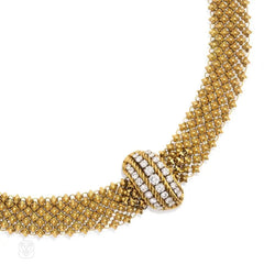 Gold chain mail necklace with diamond centerpiece