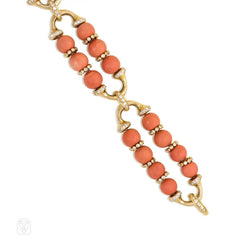 Gold, coral bead, and diamond bracelet