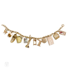 Gold curblink charm bracelet wtih 12 charms