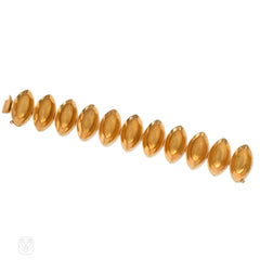 Gold navette link bracelet with Florentine finish