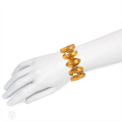 Gold navette link bracelet with Florentine finish