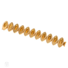 Gold navette link bracelet with Florentine finish