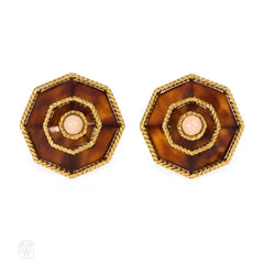 Gold, tortoise shell, and coral earrings, Boucheron.