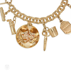 Gold travel theme charm bracelet