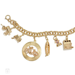 Gold travel theme charm bracelet