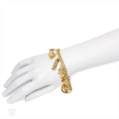 Gold travel theme charm bracelet
