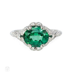 Green zircon solitaire ring with Edwardian style platinum band