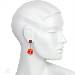 Long cinnamon-colored glass and coral beaded earrings