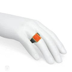 Modernist coral, onyx, and gold ring