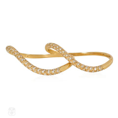 Pair of gold and diamond wave bracelets