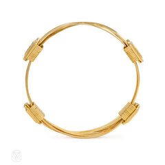 Pair of gold and gemset bangle bracelets