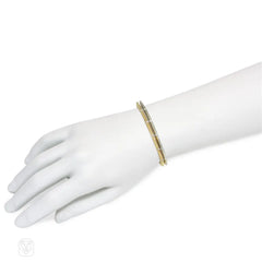Pair of Italian white and yellow gold and diamond bracelets