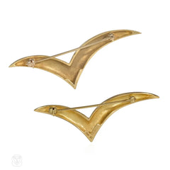 Pair of Tiffany gold stylized bird brooches