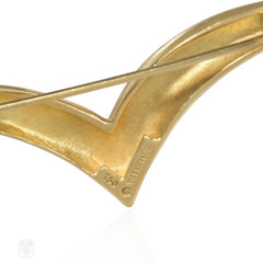 Pair of Tiffany gold stylized bird brooches