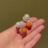 Mid-century toi et moi pearl, coral, and diamond earrings