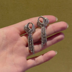 French day-to-night diamond loop and tassel earrings