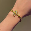 Antique bypass gold and gemset snake bracelet