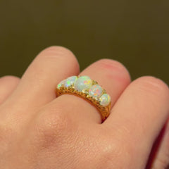 Antique graduated opal half-hoop ring