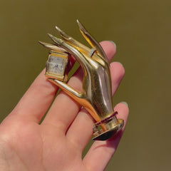 Retro Flato gold, ruby, and diamond hand brooch watch