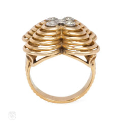 Retro gold, platinum, and diamond flower-form ring.