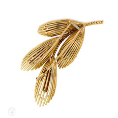 Retro gold, ruby, and diamond foliate motif brooch