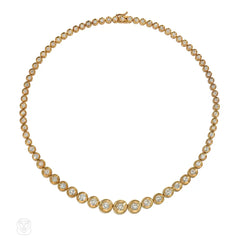 Retro style tapering gold and diamond disc necklace