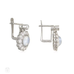 White gold, diamond, and moonstone cluster design earrings